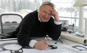 Finnish designer Eero Aarnio working at his desk. 